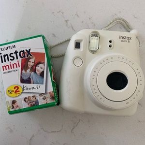 White Instax mini 8 camera and film